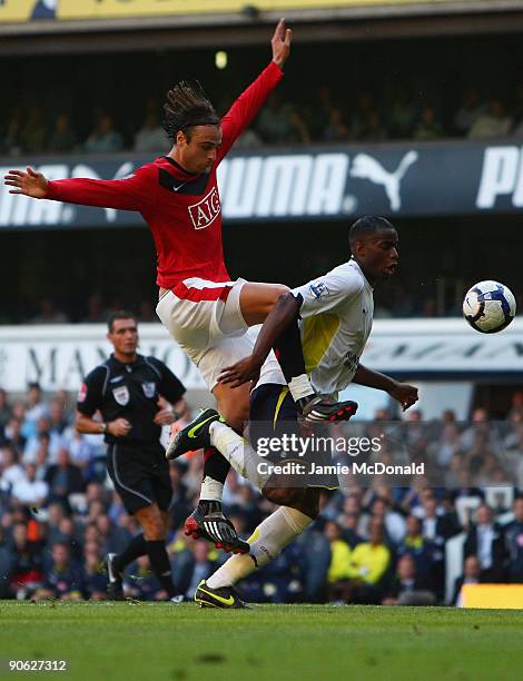 Dimitar Berbatov of Manchester United battles with Sebastien Bassong of Tottenham Hotspur during the Barclays Premier League match between Tottenham...