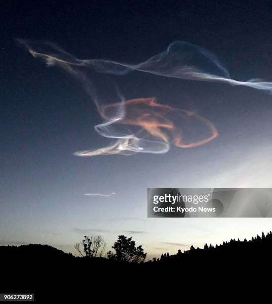 Photo taken Jan. 18 shows contrails left in the sky by the Epsilon-3 rocket carrying a small radar satellite that was successfully launched from the...