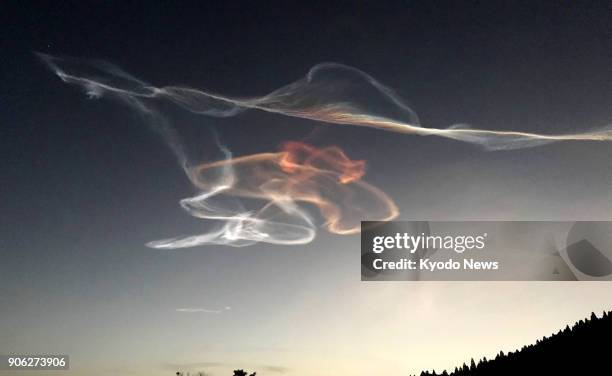 Photo taken Jan. 18 shows contrails left in the sky by the Epsilon-3 rocket carrying a small radar satellite that was successfully launched from the...