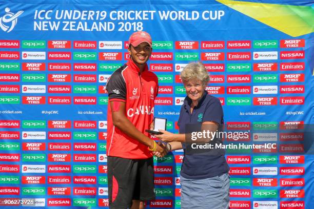 Akash Gill of Canada receives the player of the match award from Catherine Campbell former New Zealand cricketer at the ICC U19 Cricket World Cup...