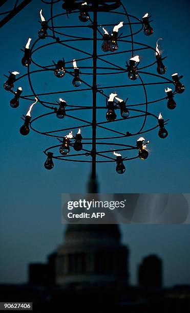 St Paul's Cathedral appears behind a sculpture as the "Fire Garden" designed by French fire masters Compagnie Carabosse is opened to the public...