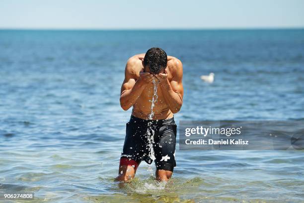 Richie Porte of Australia and BMC Racing Team cools off in the ocean after stage three of the 2018 Tour Down Under on January 18, 2018 in Adelaide,...