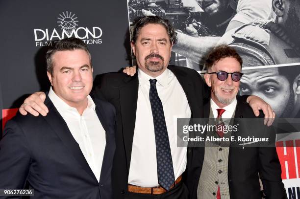 Tucker Tooley, Christian Gudegast and Mark Canton attend the premiere of STX Films' "Den of Thieves" at Regal LA Live Stadium 14 on January 17, 2018...