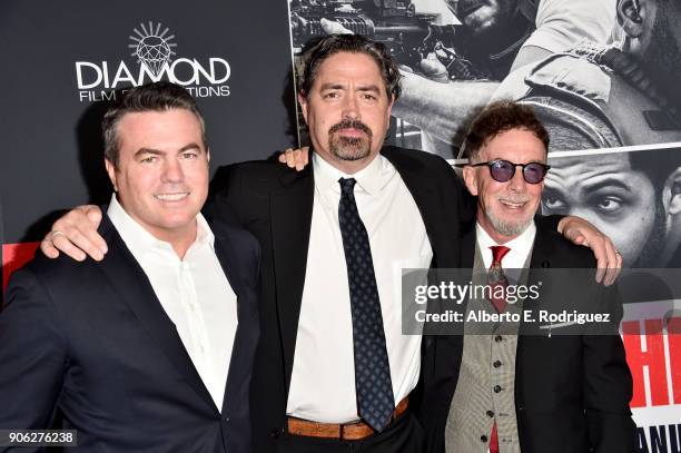 Tucker Tooley, Christian Gudegast and Mark Canton attend the premiere of STX Films' "Den of Thieves" at Regal LA Live Stadium 14 on January 17, 2018...