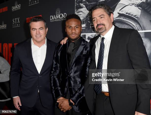 Tucker Tooley, Ron J. Rock and Christian Gudegast attend the premiere of STX Films' "Den of Thieves" at Regal LA Live Stadium 14 on January 17, 2018...