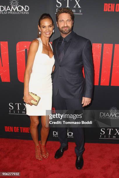 Gerard Butler and Morgan Brown attend the Premiere Of STX Films' "Den Of Thieves" at Regal LA Live Stadium 14 on January 17, 2018 in Los Angeles,...