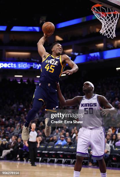 Donovan Mitchell of the Utah Jazz dunks on Zach Randolph of the Sacramento Kings at Golden 1 Center on January 17, 2018 in Sacramento, California....