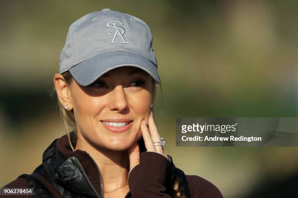 Erica Stoll, wife of Rory McIlroy of Northern Ireland, looks on during round one of the Abu Dhabi HSBC Golf Championship at Abu Dhabi Golf Club on...