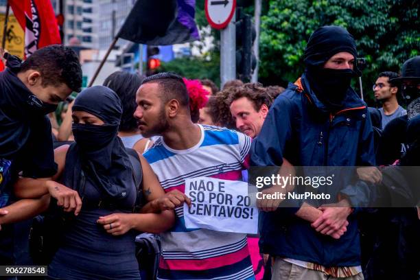 Demonstrators march during a protest against the fare hike on public transportation in Sao Paulo, Brazil, Wednesday, Jan. 17, 2018. The protest was...