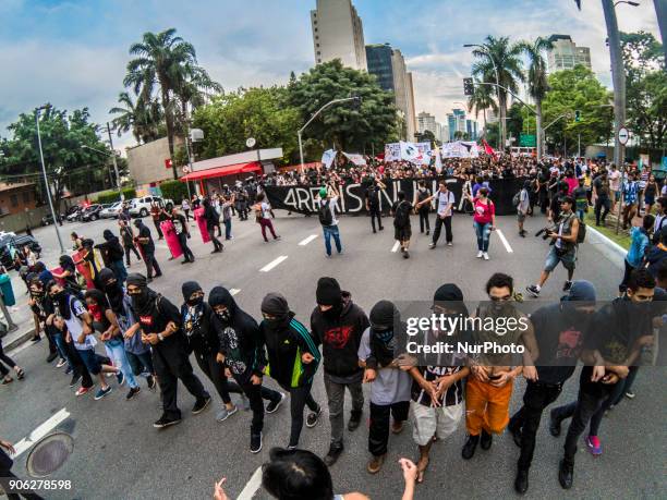 Demonstrators march during a protest against the fare hike on public transportation in Sao Paulo, Brazil, Wednesday, Jan. 17, 2018. The protest was...