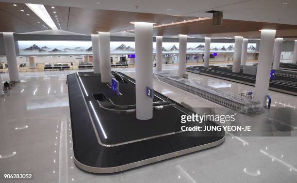 This picture taken on November 21, 2017 shows a general view of the baggage claim at Terminal 2 of Incheon International Airport, west of Seoul,...