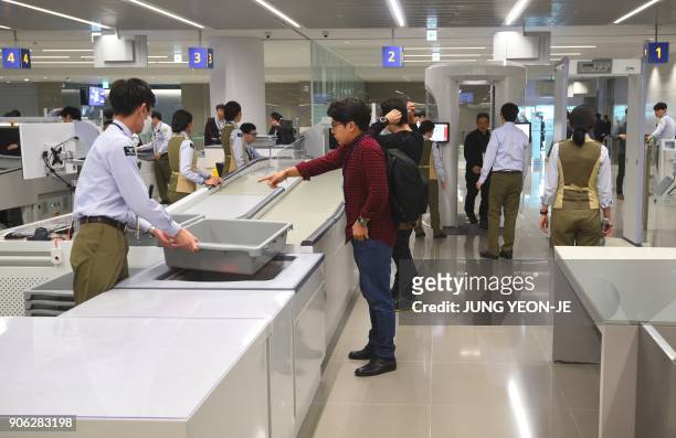 This picture taken on November 21, 2017 shows a general view of a security checkpoint at Terminal 2 of Incheon International Airport, west of Seoul,...