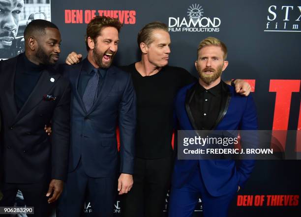Actors Mo McRae, Gerard Butler, Brian van Holt and Kaiwi Lyman pose on arrival for the premiere of the film "Den of Thieves" in Los Angeles,...