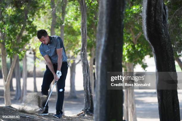 Chris Hanson of England plays his third shot on the 13th hole during round one of the Abu Dhabi HSBC Golf Championship at Abu Dhabi Golf Club on...