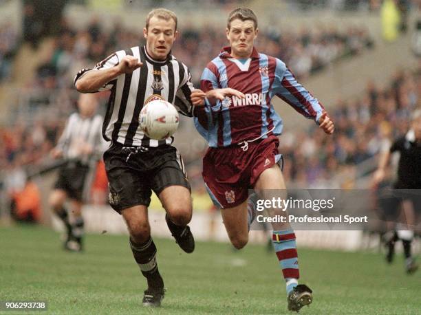Alan Shearer of Newcastle United and Clint Hill of Tranmere Rovers battle for the ball during an FA Cup 5th Round tie at St James' Park on February...