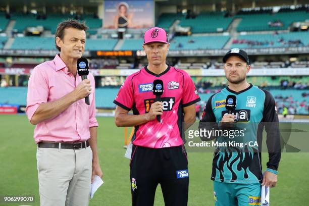 Former cricketer and commentator Adam Gilchrist speaks on camera to captains Brendon McCullum of the Heat and Johan Botha of the Sixers during the...
