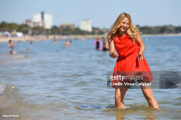 Marta Kostyuk of Ukraine making the most of the hot Melbourne weather by visiting Albert Park beach during day four of the 2018 Australian Open at...