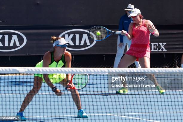 Alicja Rosolska of Poland and Abigail Spears of the United States compete in their first round women's doubles match against Alize Cornet of France...