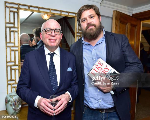 Author Michael Wolff and Fredrik Carlstrom attend publisher Henry Holt toasts Michael Wolff's "Fire and Fury" at Private Residence on January 17,...