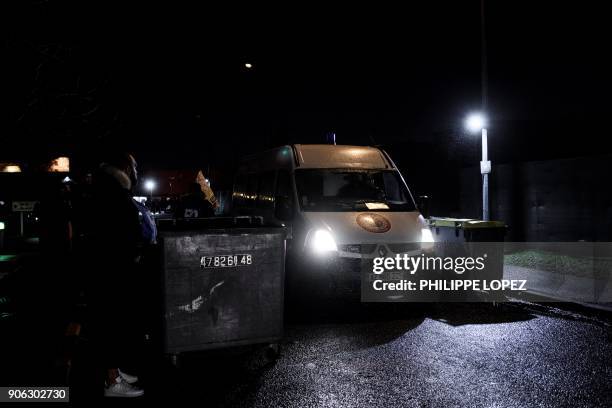 Prison guards let a prison van drive through as they block access to the Nanterre prison on January 18, 2018 to demand tighter security after three...