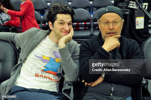 Actors Ben Schwartz and Billy Crystal attend a basketball game between the Los Angeles Clippers and the Denver Nuggets at Staples Center on January...