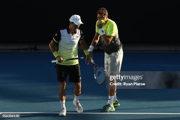 Mikhail Kukushkin of Kazakhstan and Denis Istomin of Uzbekistan compete in their first round men's doubles match against Sam Groth of Australia and...