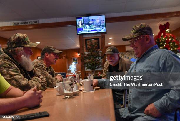 What's known jokingly as the "Liars Table" at the Kac-Ka-Pon Restaurant, locals like Isaac Kohne, left not pictured, Gary Dalton, second left, Colin...