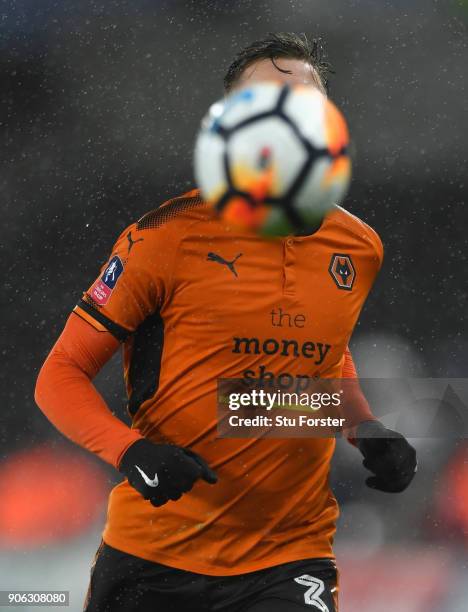 Wolves player Barry Douglas is hidden by the ball during the Emirates FA Cup third round replay between Swansea City and Wolverhampton Wanderers at...