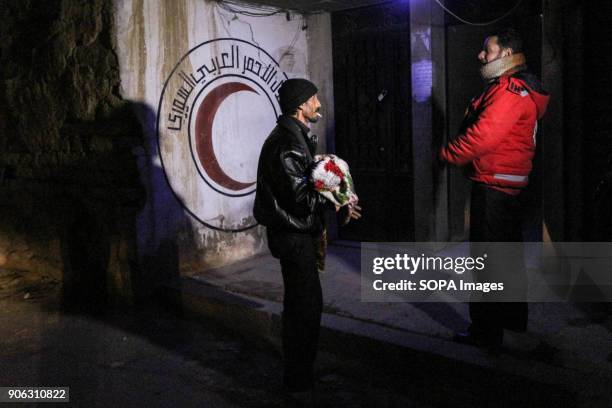 Father seen carrying his son as he return to the besieged town of Douma. Five children with serious illnesses returned to the eastern al-Gouta from...