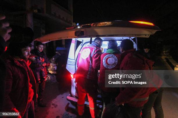 Medical team seen taken care of a child in an ambulance. Five children with serious illnesses returned to the eastern al-Gouta from Damascus, after...