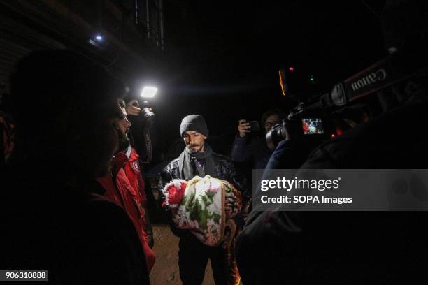 Father seen carrying his son as he return to the besieged town of Douma. Five children with serious illnesses returned to the eastern al-Gouta from...