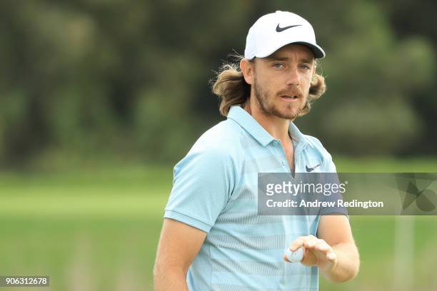 Tommy Fleetwood of England reacts on the seventh green during round one of the Abu Dhabi HSBC Golf Championship at Abu Dhabi Golf Club on January 18,...
