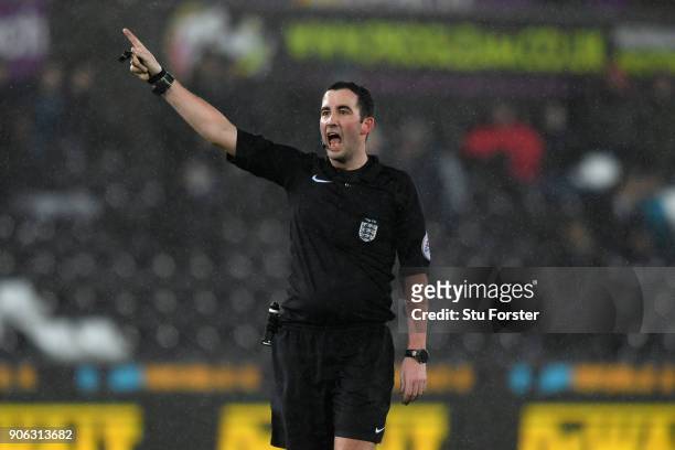 Referee Chris Kavanagh reacts during the Emirates FA Cup third round replay between Swansea City and Wolverhampton Wanderers at Liberty Stadium on...
