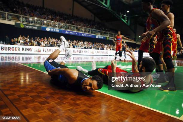 Mika Vukona of the Breakers slides on the deck after clashing with Tohi Smith-Milner of United during the round 16 NBL match between the New Zealand...