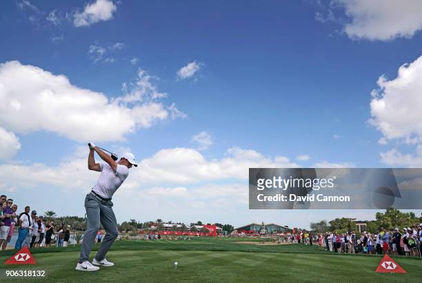 Rory McIlroy of Northern Ireland plays his tee shot on the par 4, ninth hole during the first round of the 2018 Abu Dhabi HSBC Golf Championship at...