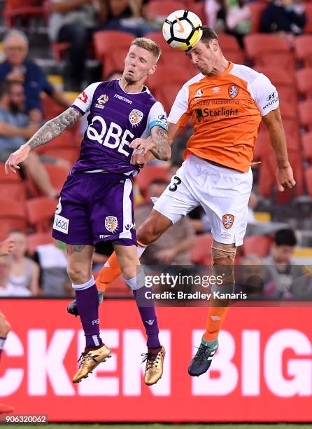 Luke DeVere of the Roar and Andrew Keogh of the Glory challenge for the ball during the round 17 A-League match between the Brisbane Roar and the...