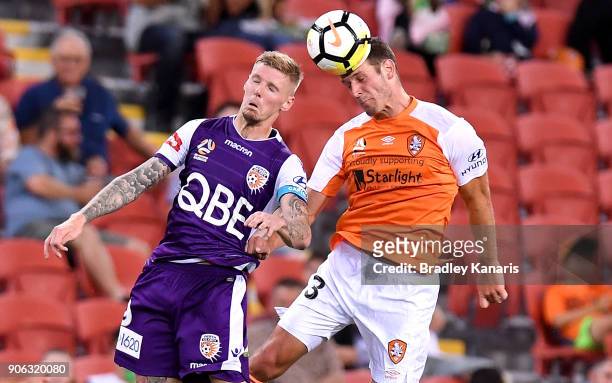 Luke DeVere of the Roar and Andrew Keogh of the Glory challenge for the ball during the round 17 A-League match between the Brisbane Roar and the...