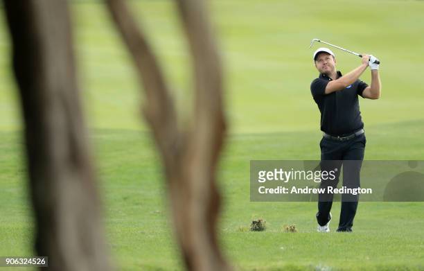 Richard Sterne of South Africa plays a shot on the 13th hole during round one of the Abu Dhabi HSBC Golf Championship at Abu Dhabi Golf Club on...