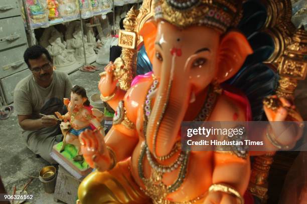 An artist making idols of Ganesh for the upcoming Maghi Ganesh Chaturthi festival, at Thane workshop, on January 17, 2018 in Mumbai, India.