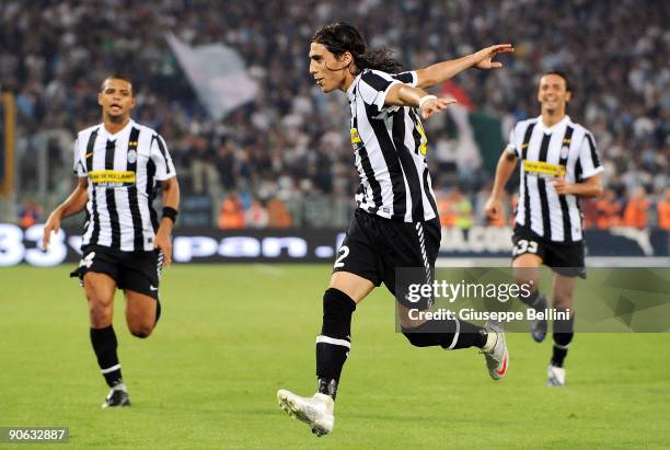Martin Caceres of Juventus celebrates with his team mates after scoring the opeing goal during the Serie A match between Lazio and Juventus at Stadio...