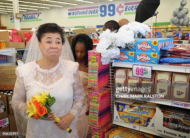 Gwen Whitmore waits for her 99 cent wedding ceremony at the 99 cent store in Los Angeles on September 9, 2009. The budget supermarket chain helped...