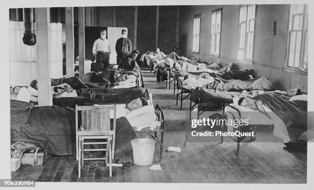 View of victims of the Spanish flu cases as they lie in beads at a barracks hospital on the campus of Colorado Agricultural College, Fort Collins,...