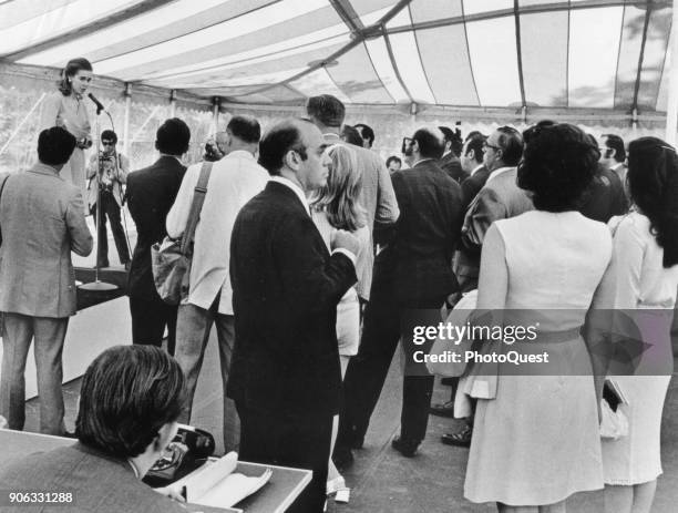 Under a tent on the White House grounds, Press Secretary Constance Cornell Stuart briefs reporters outside prior to Tricia Nixon and Edward Cox's...