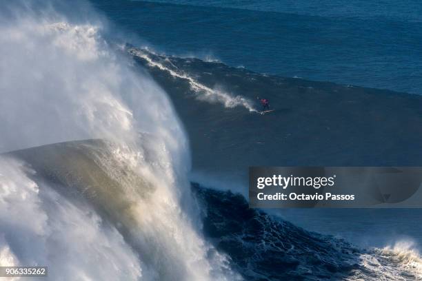 French big wave surfer Benjamin Sanchez, drops a wave during a surf session at Praia do Norte on January 18, 2018 in Nazare, Portugal.