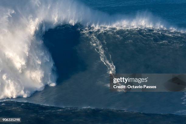 French big wave surfer Benjamin Sanchez, drops a wave during a surf session at Praia do Norte on January 18, 2018 in Nazare, Portugal.