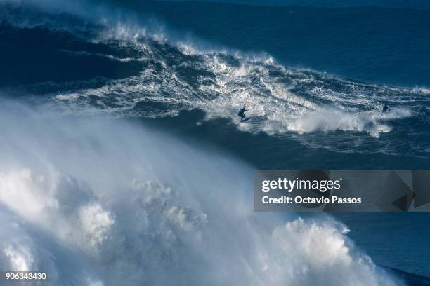 German big wave surfer Sebastian Steudtner, drops a wave during a surf session at Praia do Norte on January 18, 2018 in Nazare, Portugal.