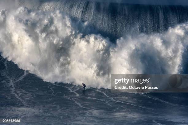 Australian big wave surfer Ross Clarke-Jones, drops a wave during a surf session at Praia do Norte on January 18, 2018 in Nazare, Portugal.