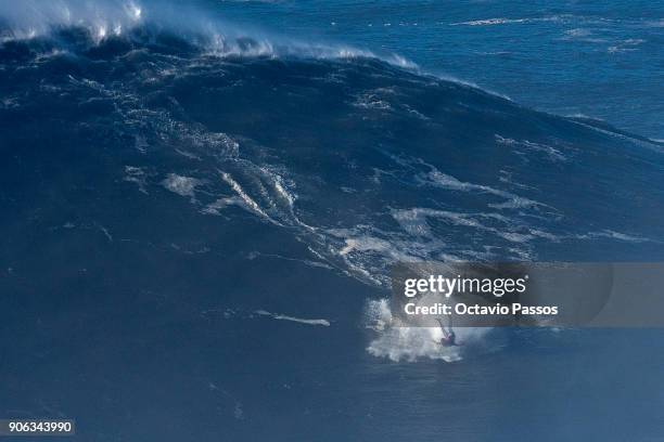 Brazilian big wave surfer Eric Rebiere, wipeout on wave during a surf session at Praia do Norte on January 18, 2018 in Nazare, Portugal.