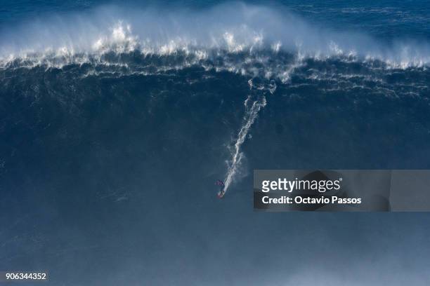 Australian big wave surfer Ross Clarke-Jones, drops a wave during a surf session at Praia do Norte on January 18, 2018 in Nazare, Portugal.