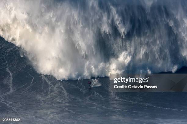 Australian big wave surfer Ross Clarke-Jones, drops a wave during a surf session at Praia do Norte on January 18, 2018 in Nazare, Portugal.